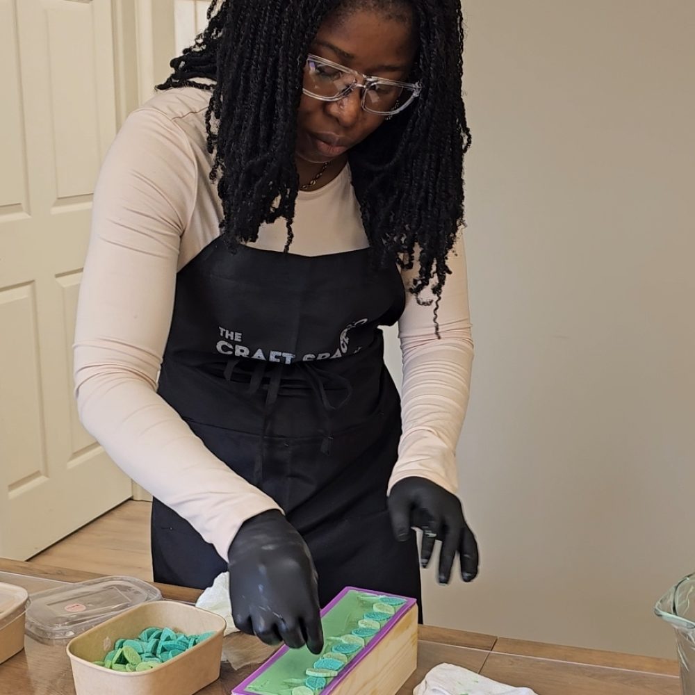 Partisipant decorating the soap with soap embeds